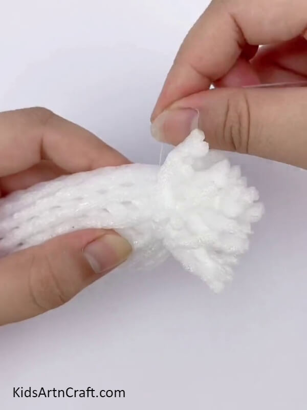 Tie A White Thread Around White Fruit Foam- Making Flowers Out of Fruit Foam Covers - A Fun Activity For Children 