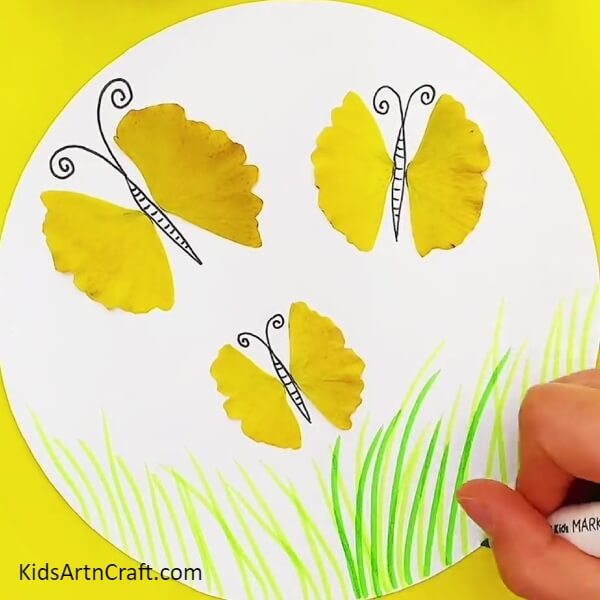Making More Grass-Helping kids to make leafy butterflies by means of a craft painting guide