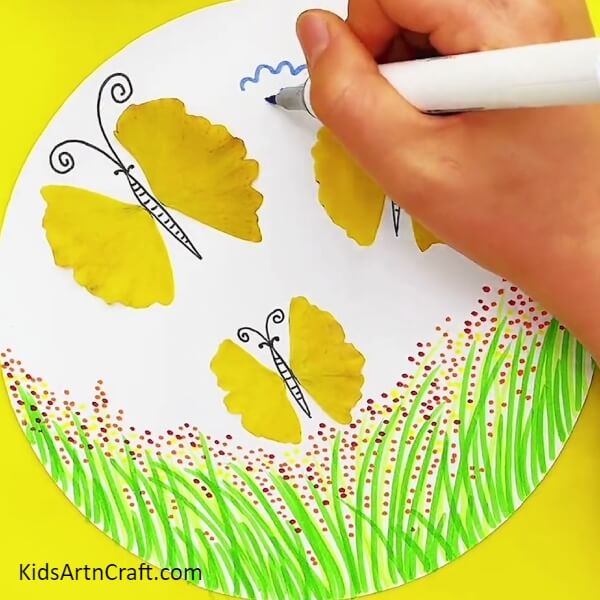 Making Clouds-Teaching youngsters to make paint-decorated butterfly images using leaves