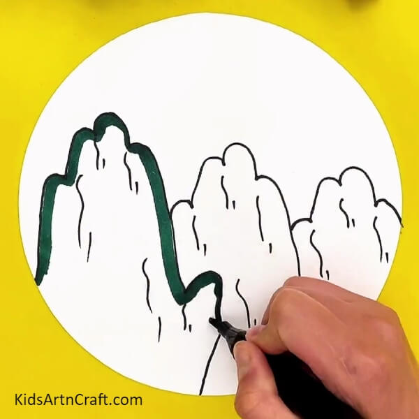 Coloring Outline Using A Dark Green Sketch Pen. Complete tutorial to make mountain scenery beautifully for kids