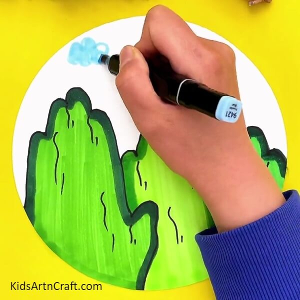 Drawing Clouds With A Light Blue Sketch Pen. Creative colouring to the beautiful mountains for kids