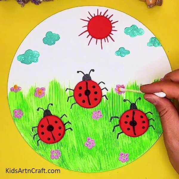 Making The Center Of Flowers-A creative project with a ladybug and garden scenery made out of clay