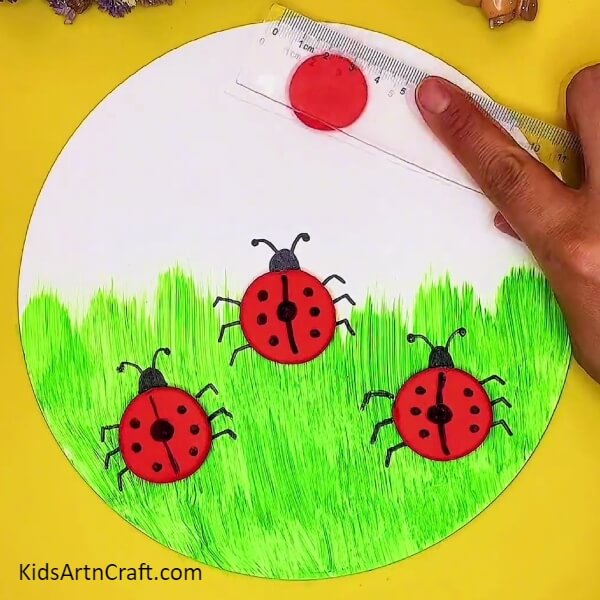 Making More Ladybugs And The Sun-An imaginative clay idea of a ladybug and garden display