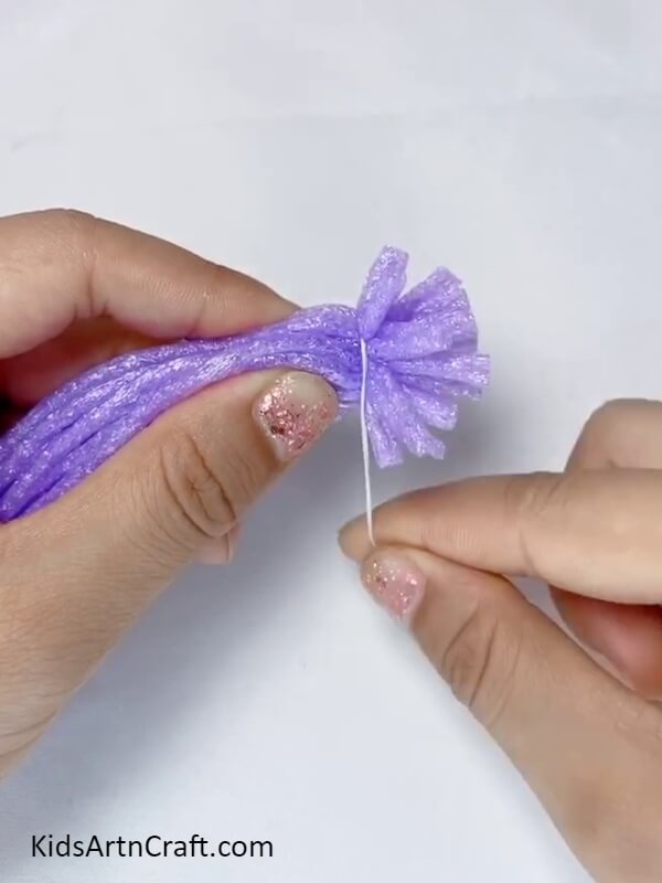 Tieing A Thread Around The Foam Strips- Crafting a Lavender Bouquet with Fruit Foam Pom Poms