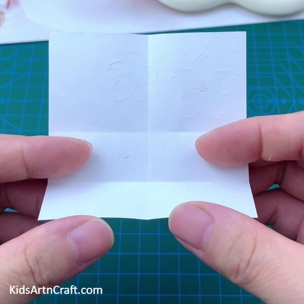 Folding The Paper To The Horizontal '+' Crease- Step-by-Step Instructions to Craft an Envelope Out of Paper with Origami