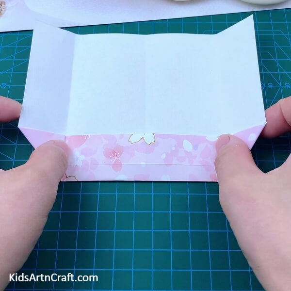 Folding The Corners To Form Triangles- Step-by-Step Instructions for Making an Origami Envelope 