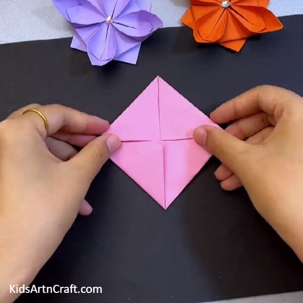 Next Steps Towards Origami Lotus- Folding an Origami Lotus in a Square Configuration