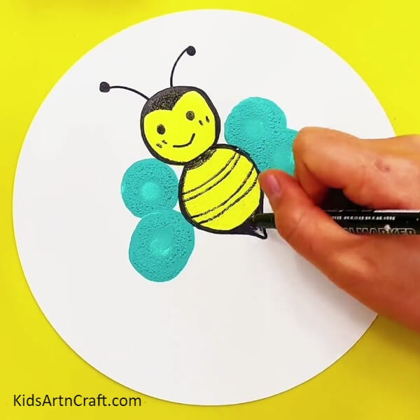 Adding details on Bee's Belly- A Comprehensive Guide to Paint Stamping Bee Art 