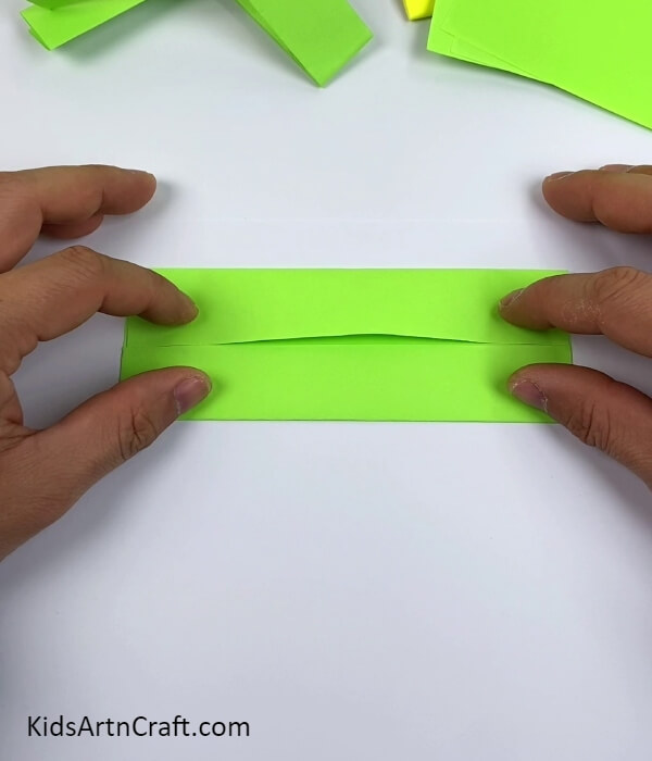 Folding The Sides To The Crease-How To Make Paper Gun -Ideas To Use Origami Paper