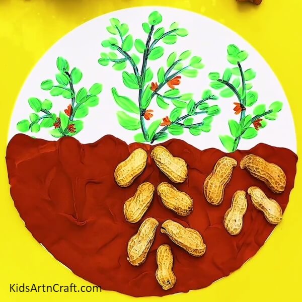 Making Roots Of Right-Side Plant- Crafting garden art out of clay and peanut shells 