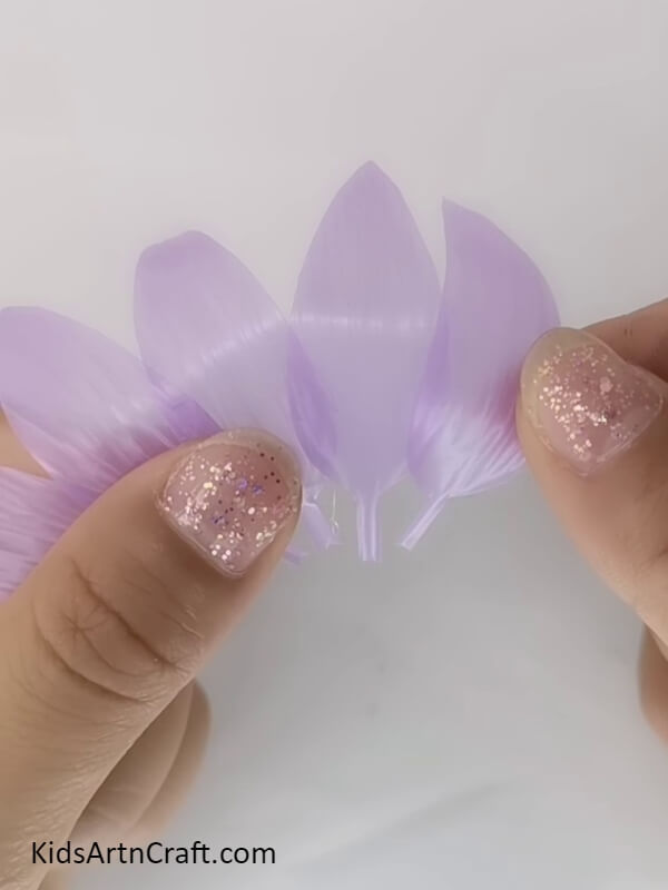 Sticking The Petals Together-Pretty Blossom Craft Using Plastic Straws
