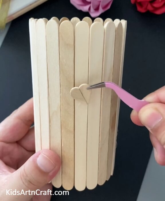 Sticking The Ends To Form A Heart-DIY Tutorial on how to assemble a Popsicle Sticks Pencil Stand