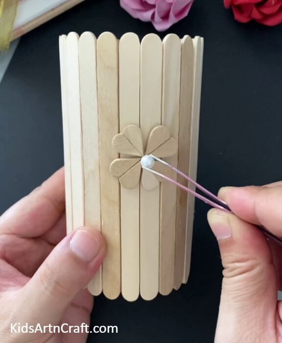 Pasting A Craft Pearl-.Step-by-step guide to creating a stunning Popsicle Sticks Pencil Stand