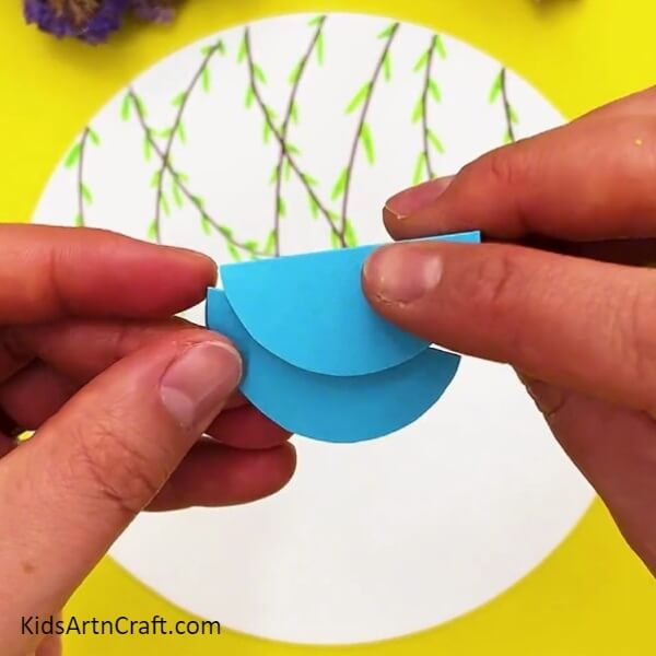 Pasting A Semicircle Over The Other- A Guide To Making Paper Birds For Kids 