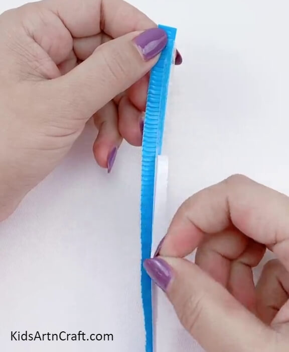Applying double sided tape. Pretty Straw Flower Bouquet Craft Tutorial For beginner