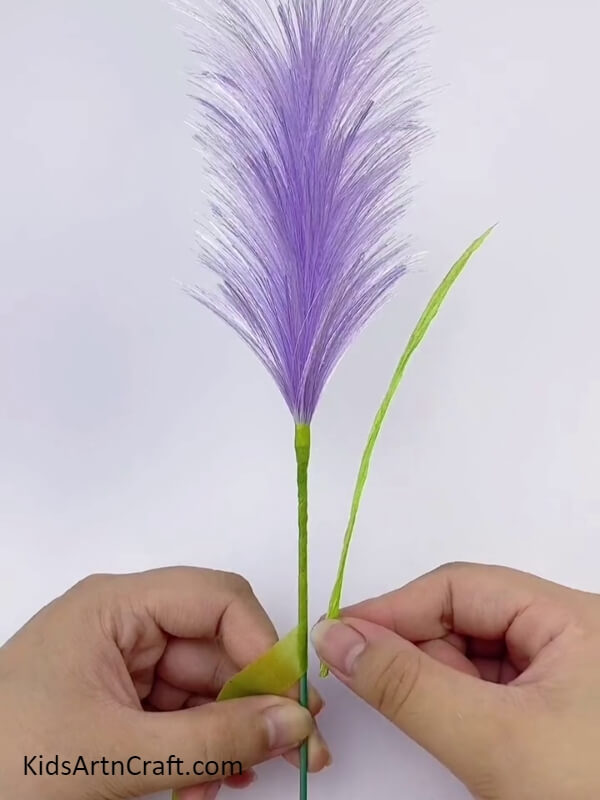 Rolling Green Floral Tape With A Wooden Stick- Step-by-Step Guide to Constructing a 3D Purple Pampas Grass Project with Ribbon for Kids