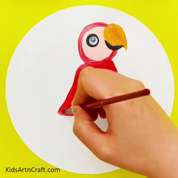 Pasting Googly Eye And Making Body Of The Parrot - A tutorial on how to make a rainbow parrot painting, perfect for kids.
