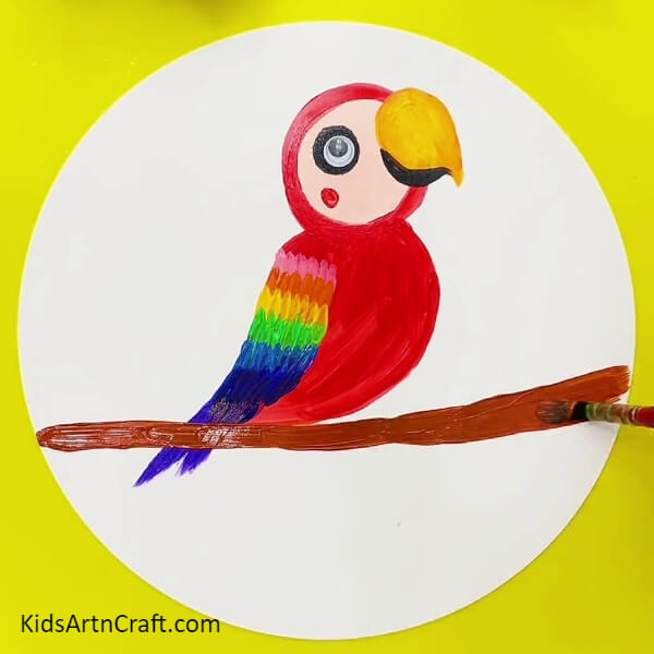 Making A Tree Branch - A guide for kids to follow to achieve a rainbow parrot painting.