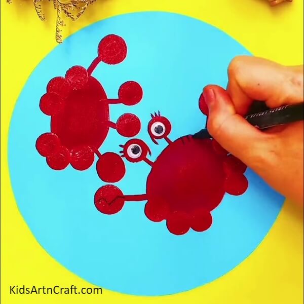 Making Another Crab, Pasting Eyes, And Detailing The Crab- A Guide to Painting Red Crabs in the Water for Little Ones