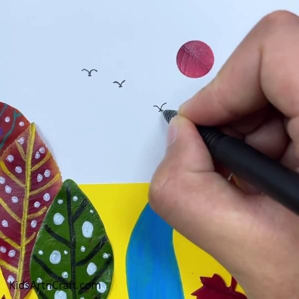 Draw The Birds With A Black Sketch Pen- Creating Art with River Landscapes and Autumn Leaves