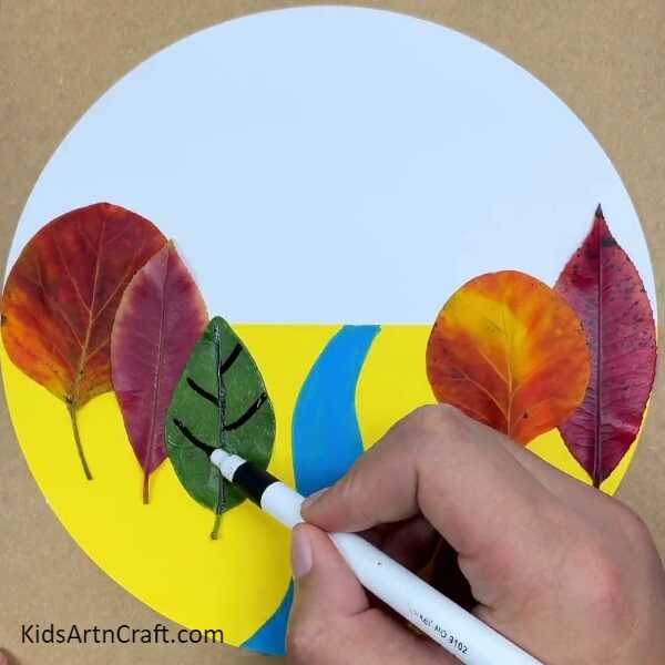 Make Details In The Leaves With A Black Sketch Pen- Crafting with River Views and Fall Leaves