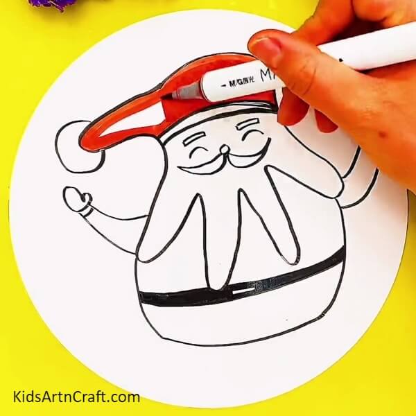 Coloring The Santa's Cap-Making a Santa Representation From a Hand Outline Step by Step