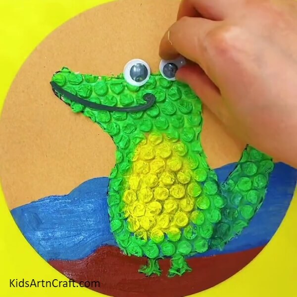 Pasting Eyes-Developing a Crocodile Craft with Bubble Wrap 