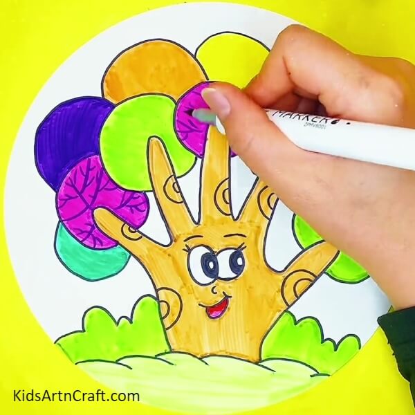 Make veins in the circles with different markers/sketchpens-A tutorial on producing a tree shape using a hand outline