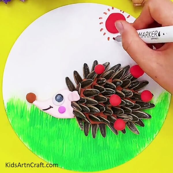 Complete the Sun- Craft a hedgehog out of clay and sunflower seeds, a fun activity for kids.