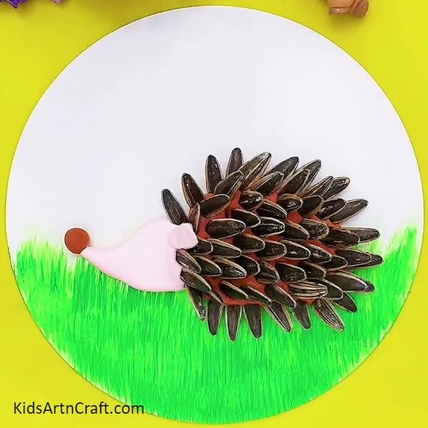 Make the Ear and Nose of the Hedgehog- A great way for kids to make a hedgehog using clay and sunflower seeds.