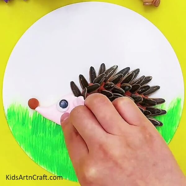 Eyes of the Hedgehog- A handmade hedgehog crafted from clay and sunflower seeds, perfect for kids.