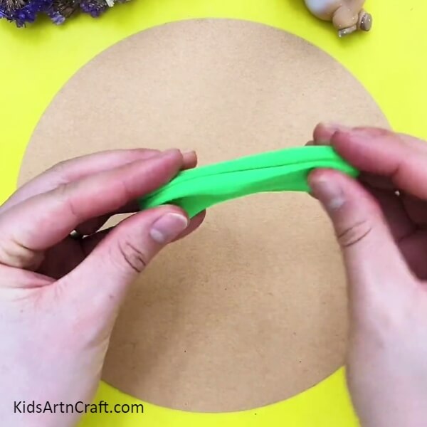 Taking Dark Green Modeling Clay-Crafting a lively cactus out of vivid clay for children. 