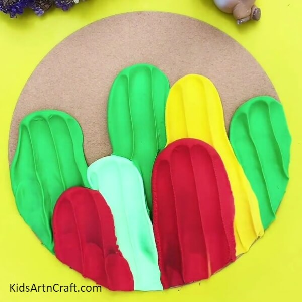 After Sticking The Modeling Clay To Make Cactus- A fun craft for kids to make a vibrant cactus with clay