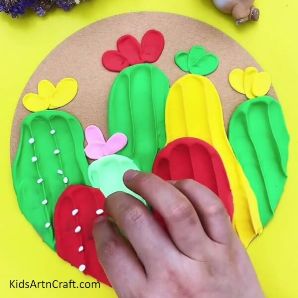 Adding Thorns To Cactus-Kids can create a vivid cactus using colorful clay. 
