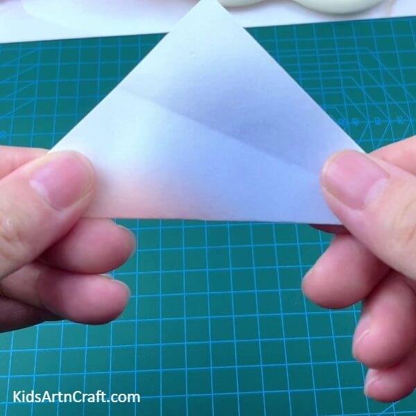 Folding The Paper Diagonally - A delightful Lollipop Paper Origami project for novices 