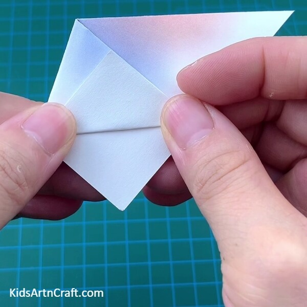 Folding The Opened-Corner - An appetizing Lollipop Paper Origami concept for starters 