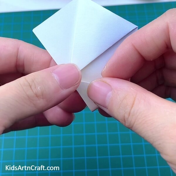 Taking The Other Unopened Corner To The Flap - A tasty Lollipop Paper Origami notion for novices 