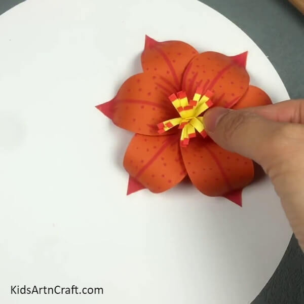 Pasting The Stripped Roll- Follow this tutorial to make a 3D Lily Paper Flower with kids