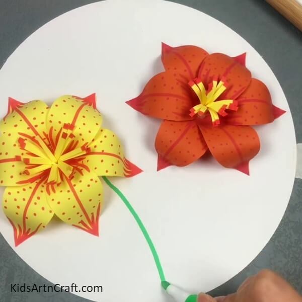 Making A Yellow Flower And Drawing Stems- Learn how to make a 3D paper lily with this kid-friendly tutorial. 