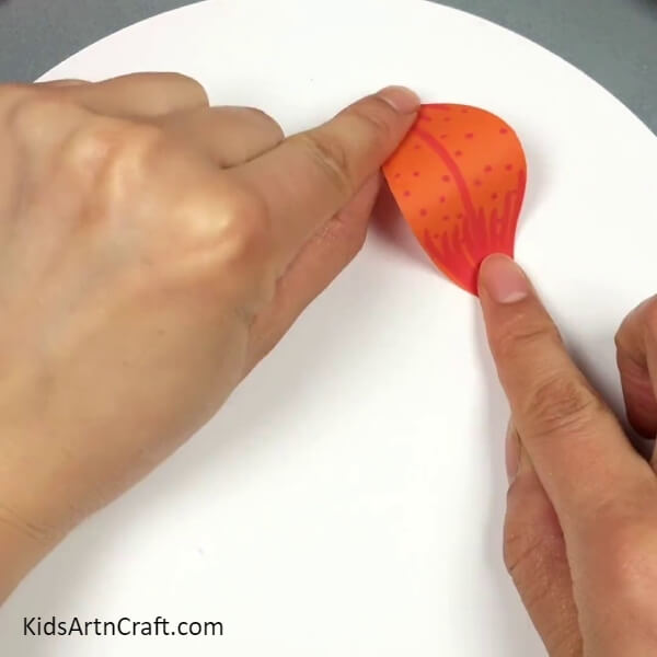 Pasting The Petal On Base- This tutorial is ideal for children to create a 3D Lily Paper Flower.