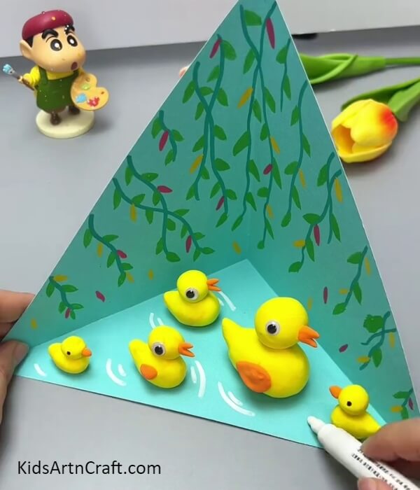 Adding Waves In The Water- Step-by-step instructions for making a three-dimensional swamp with ducks - suitable for kids