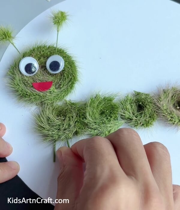 Making Legs Of The Caterpillar- Producing an Artificial Grass Strip Caterpillar Activity For Youngsters
