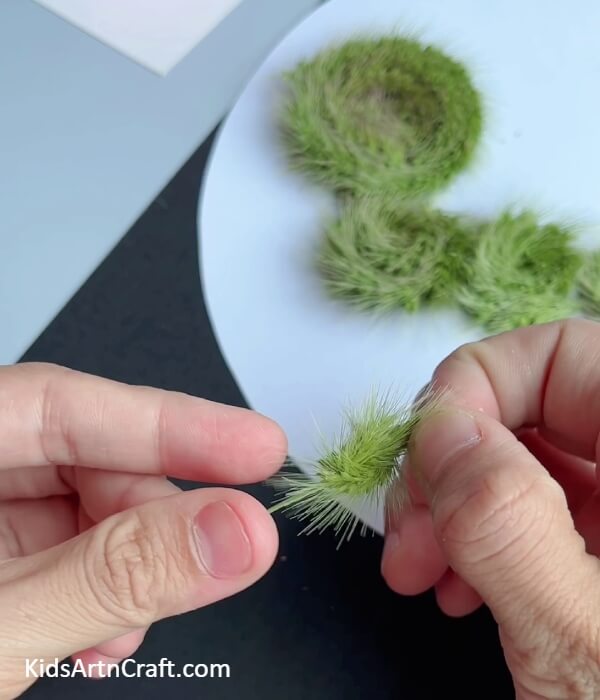 Twisting And Pasting The Grass Strand- How To Make a Fake Grass Strip Caterpillar Artwork for Kids