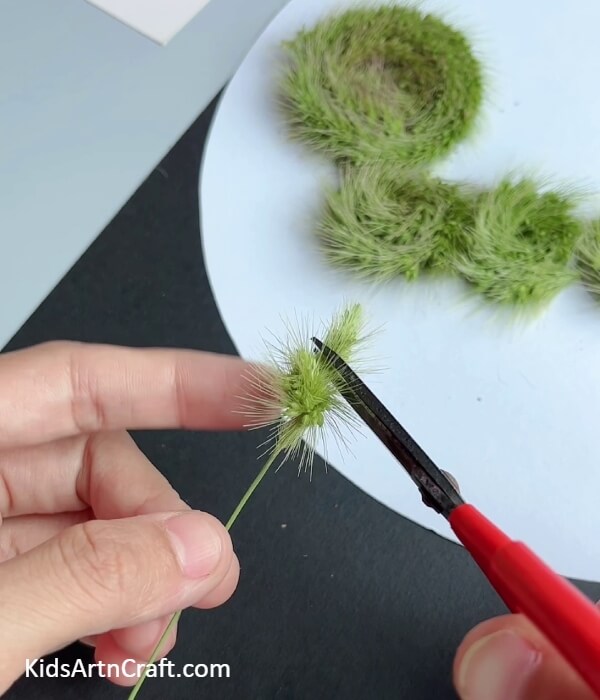 Cutting Out The Extra Part- Making an Artificial Grass Strip Caterpillar Craft with Kids