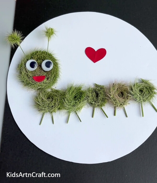 This Is The Final Look Of Your Artificial Grass Caterpillar- Constructing an Imitation Grass Band Caterpillar Activity For Children