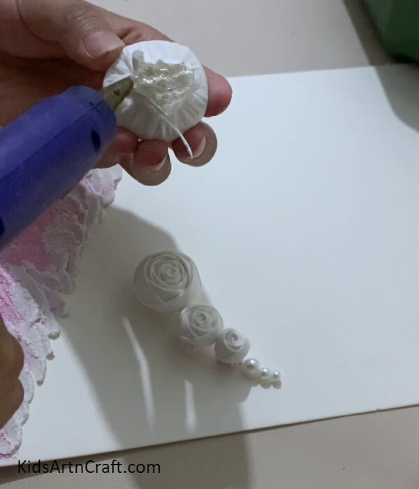 Securing The Roses And Applying Hot Glue- Home Decorating With Beautiful Napkin Roses