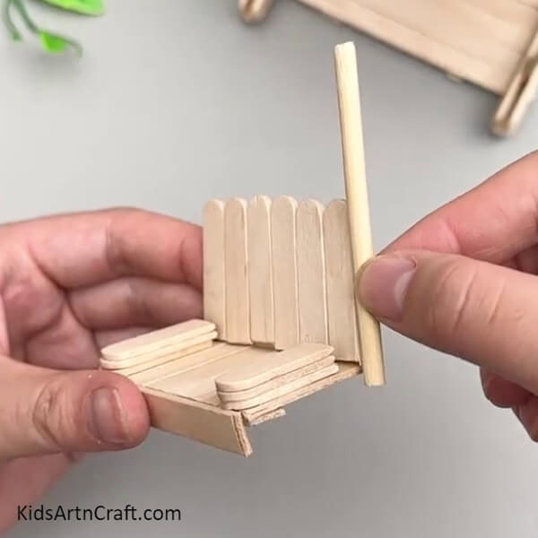 Pasting A Wooden Stick Piece On The Seat-Charming Swing Craft Tutorial Using Popsicle Sticks For Youngsters