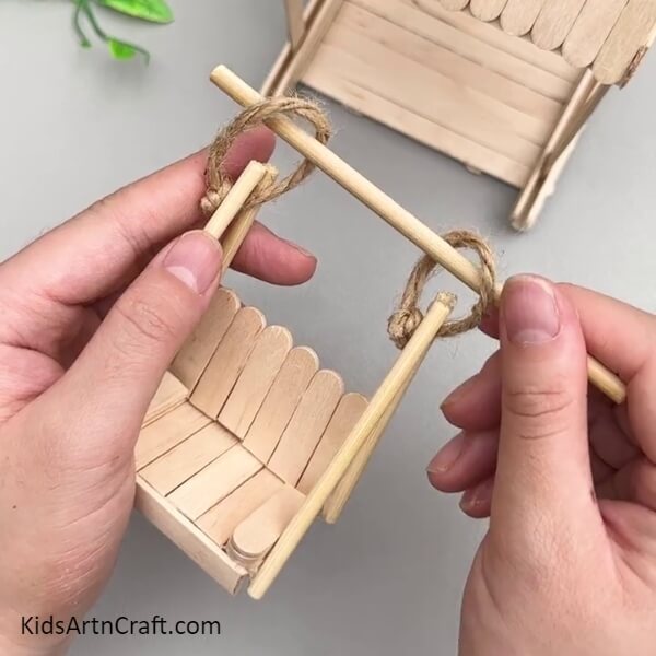 Making Another Wooden Stick Triangle And Inserting Stick In The Loops-Ravishing Swing Instructional Using Popsicle Sticks For Little Ones