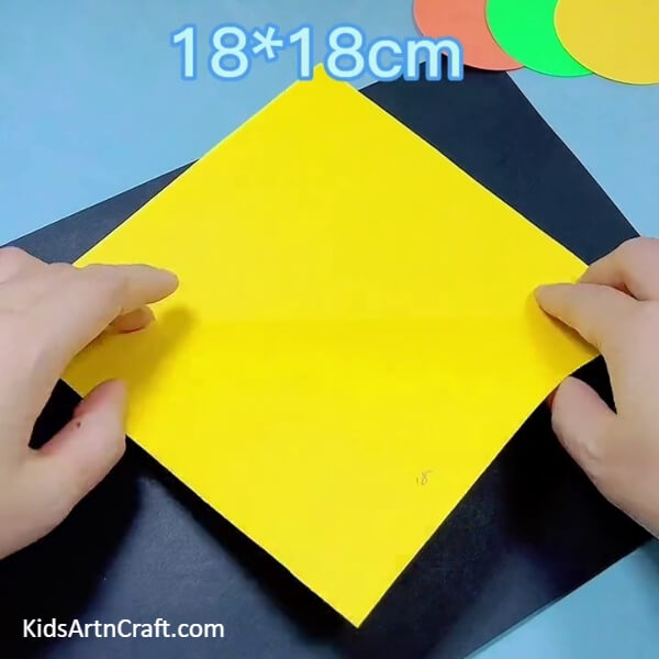 Taking A Yellow Origami Paper- Learn how to make a bulldozer out of origami paper with this tutorial for children.