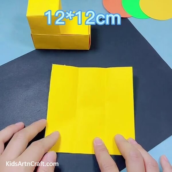 Making 'X' Creases On Ends Of A Strip- Tutorial on How to Construct a Bulldozer with Origami for Kids 